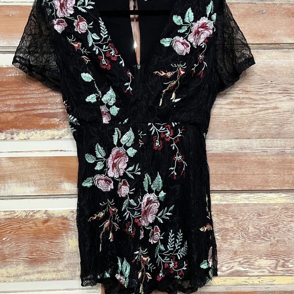 Black lace with embroidered floral designs